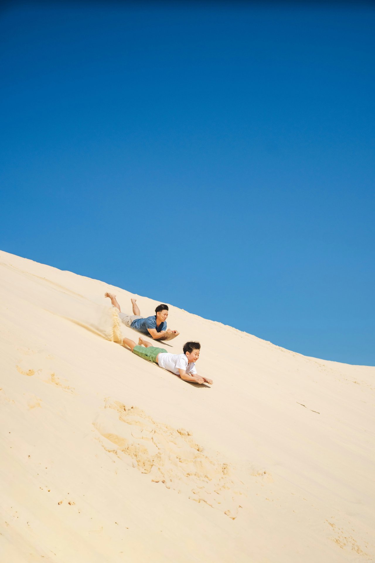 Travellers enjoying a sunny sand dune