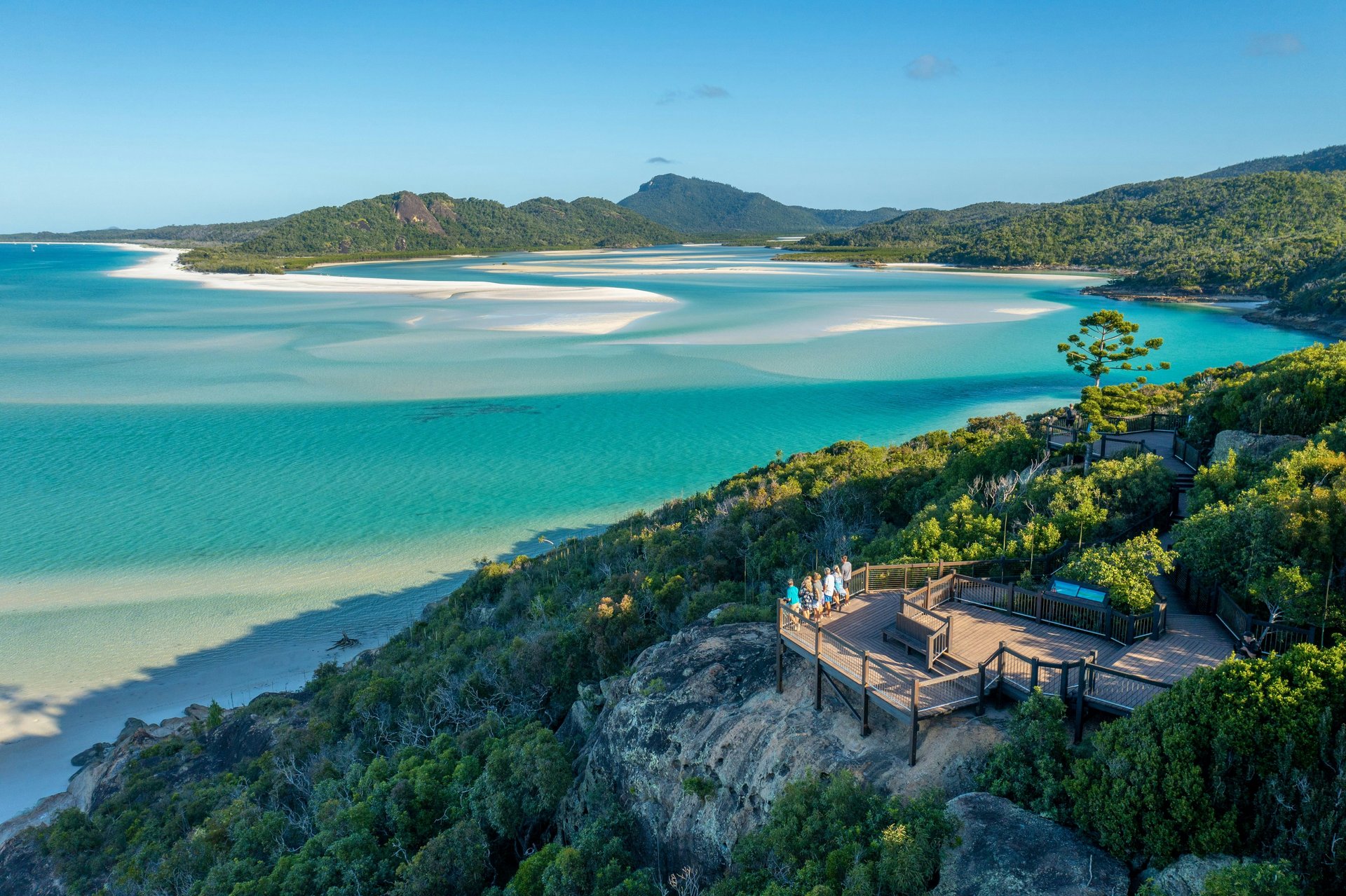 A sweeping Queensland inlet with white sand and turquoise water
